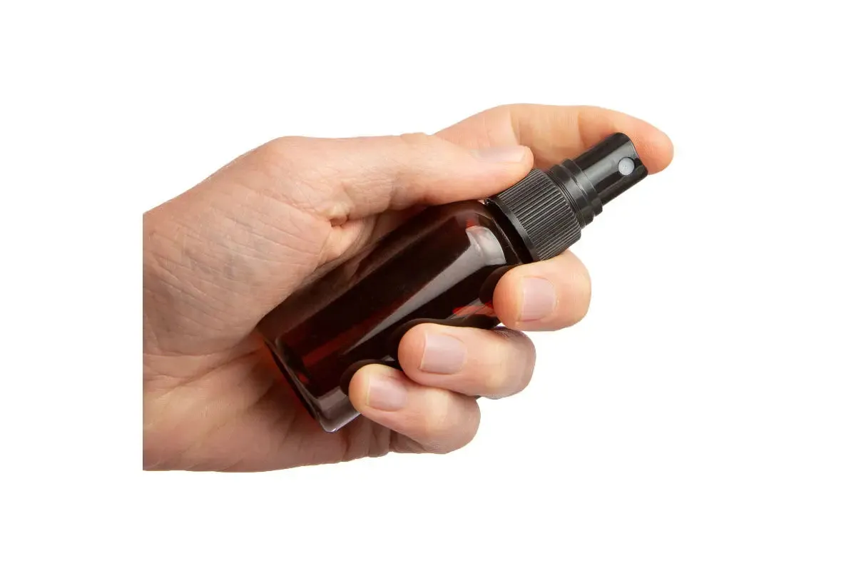 2 oz. Amber PET Plastic Boston Round Bottle with Black Misting Sprayer